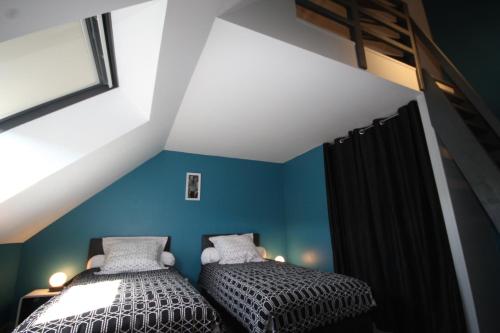 Postel nebo postele na pokoji v ubytování Gîte "Le Chemin des Moines"