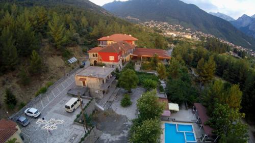 an aerial view of a house with a car parked in front at Konitsa Panorama in Konitsa