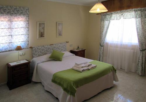 Ένα ή περισσότερα κρεβάτια σε δωμάτιο στο Casa de Millares