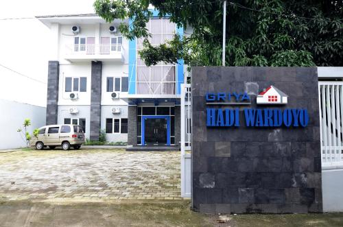 a building with a sign that reads grand had warehouse at RedDoorz near Museum Keraton Surakarta in Solo