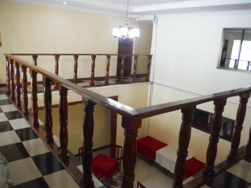 a glass table on a wooden rail in a room at Bright Star Hotel in Arusha