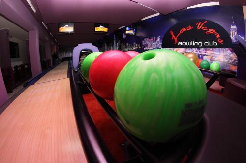 a bowling alley with bowling balls on the lanes at Hotel Copernicus in Lubawa