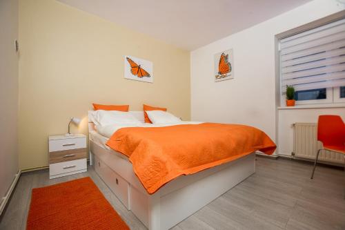 Posteľ alebo postele v izbe v ubytovaní Roze Apartment