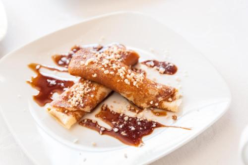 a plate of food on a white plate at Hostal Antolín in Redondela