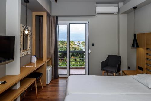 Posteľ alebo postele v izbe v ubytovaní Agamemnon Hotel
