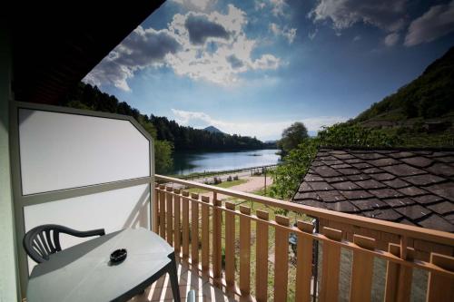 a balcony with a view of a river at Residence Hotel Miralago in Pergine Valsugana