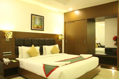 Katil atau katil-katil dalam bilik di Hotel Nk Grand Park Airport Hotel