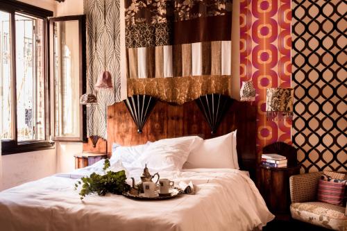 Katil atau katil-katil dalam bilik di Novecento Boutique Hotel