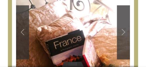 a picture of a package of france on a bed at A Cayuga LakeFront Inn - Hotel Alt, Ithaca New York in Ithaca