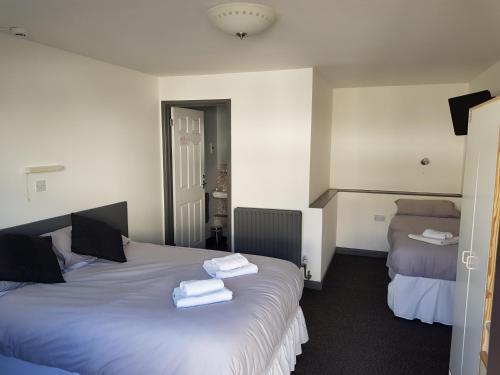 Ένα ή περισσότερα κρεβάτια σε δωμάτιο στο Old Stagecoach stables rooms only