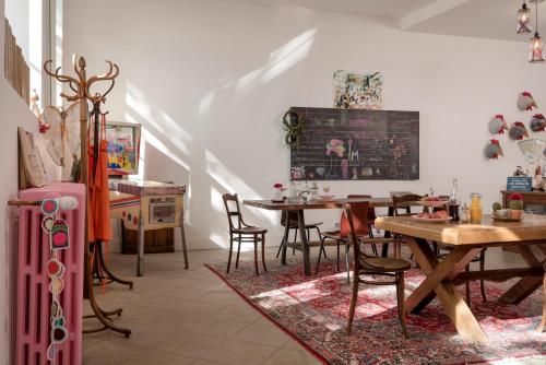 a dining room with a table and chairs at La Maison d'Ambronay in Ambronay