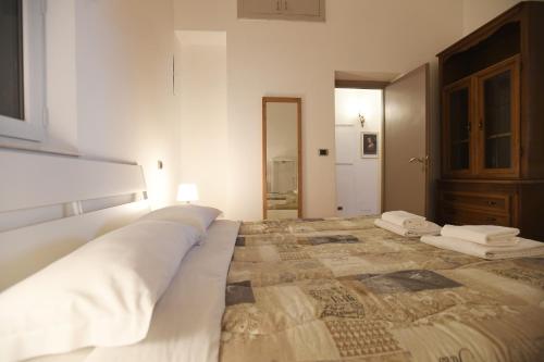 a bedroom with a large bed with two pillows on it at Lo Chalet in Rome
