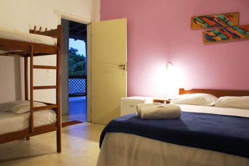 a bedroom with two bunk beds and a ladder at Pousada Vila Mundi Itaúnas in Itaúnas