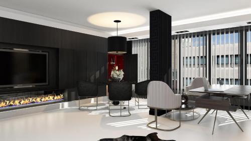 a living room with a dining table and a fireplace at New Gate Hotel in Ankara