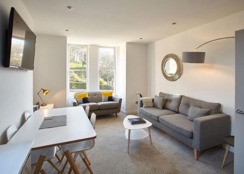 a living room with a couch and a table at Host & Stay - Park View Apartment in Whitby