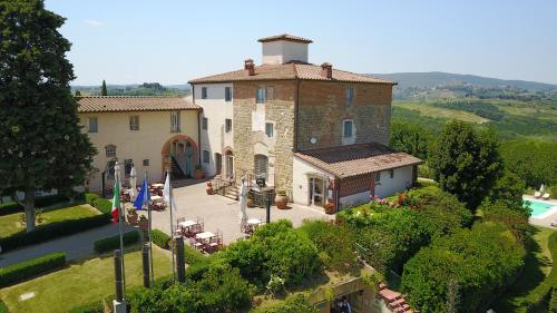 an aerial view of a large stone house with a yard at Castello di Fulignano Soarzio panoramic apartment in San Gimignano