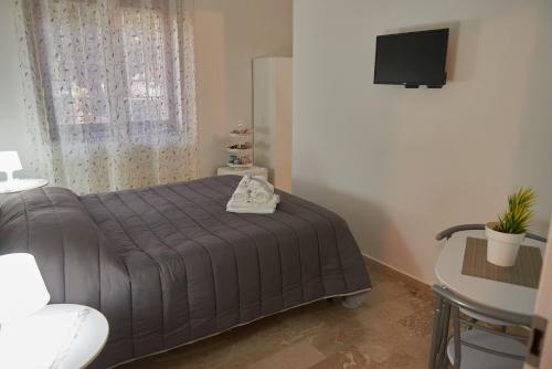 Ένα ή περισσότερα κρεβάτια σε δωμάτιο στο L'Anfiteatro di Pompei B&B