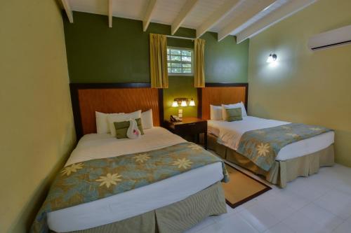 Ένα ή περισσότερα κρεβάτια σε δωμάτιο στο Blue Horizons Garden Resort