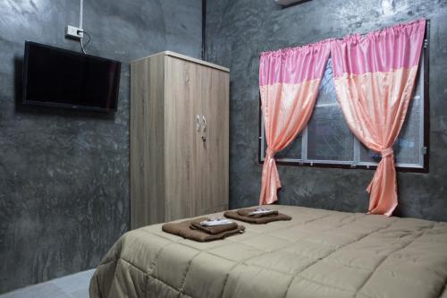 Katil atau katil-katil dalam bilik di ฺBaan Tonglong Homestay