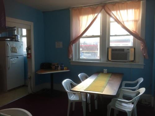 a kitchen with a table and chairs and a window at Washington International Student Center in Washington