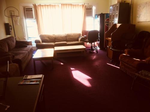 a living room with a couch and a table at Washington International Student Center in Washington