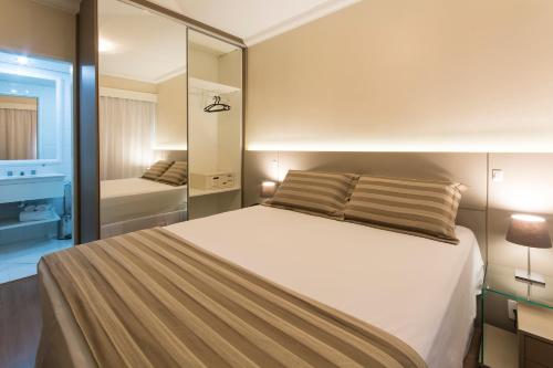 Tempat tidur dalam kamar di Tsue The Palace Flats