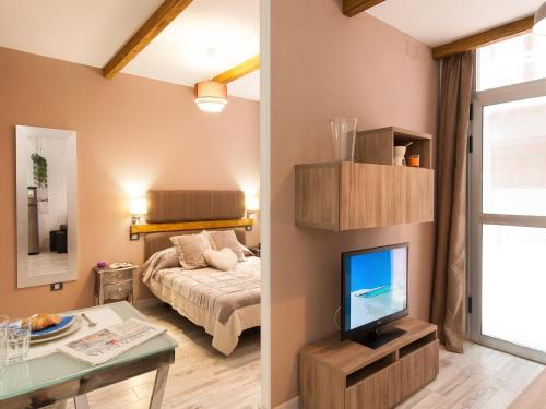 A bed or beds in a room at La Barca M&B II studio close to Las Canteras