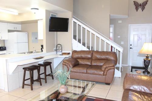 a living room with a couch and a table at Tamarind Villa MK015 in Kissimmee