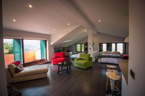 a living room with a couch and a bed at Casa Rural Arraigorri in Hernani