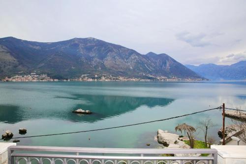 a view of a large body of water with mountains at Joković Accommodation in Kotor
