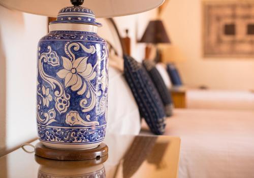 a blue and white vase sitting on a table at Casa Estrella de la Valenciana Hotel Boutique in Guanajuato
