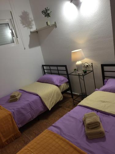 A bed or beds in a room at Apartament La Bonita