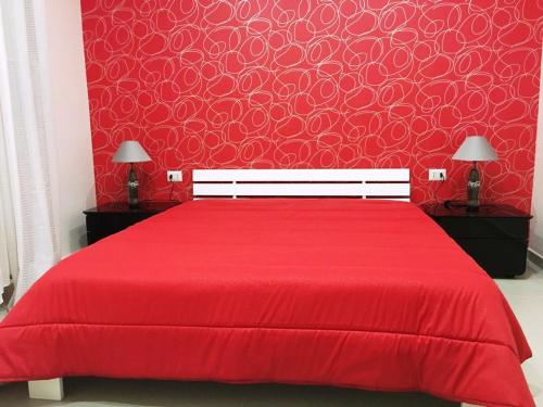Un pat sau paturi într-o cameră la La Cabala b&b