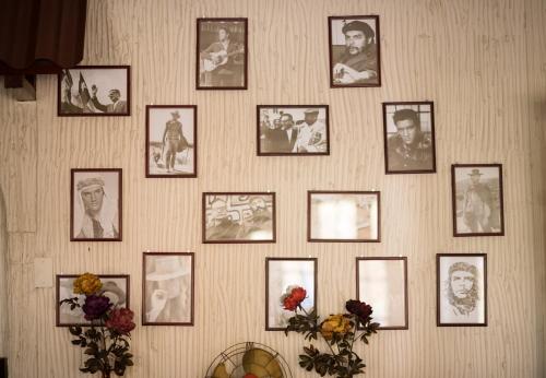 a wall with pictures of people on it at Si Hotel in Santiago