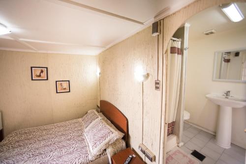 מיטה או מיטות בחדר ב-Si Hotel