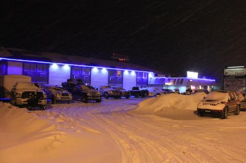 a parking lot covered in snow at night at Travelodge by Wyndham Blairmore in Blairmore
