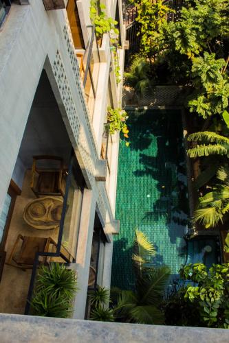 an overhead view of a swimming pool in a building at Sarina Boutique Hotel in Phnom Penh