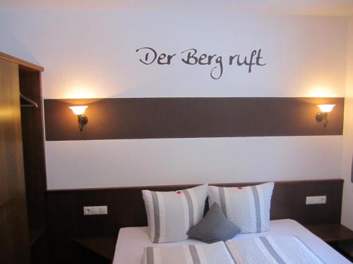 a bedroom with a bed with the words never be put at Alpenapart Walch in Jerzens