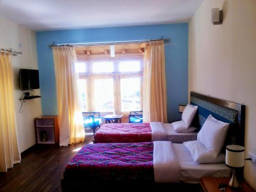 Cama o camas de una habitación en Hotel Glacier View