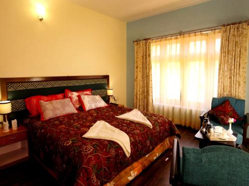 Voodi või voodid majutusasutuse Hotel Glacier View toas