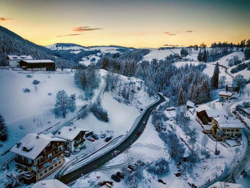 an aerial view of a resort in the snow at Rider Hotel Obereggen in Obereggen