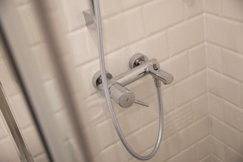 a shower with a hose in a bathroom at Villa Four Winds III in Dubrovnik
