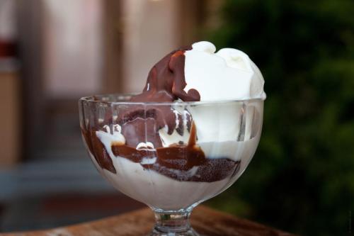 a glass cup filled with chocolate and whipped cream at Locanda Piemontese in Calice Ligure