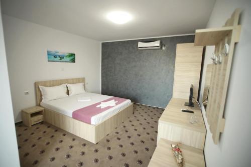 Postel nebo postele na pokoji v ubytování Vila Dorimar Mamaia Nord