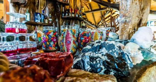 a group of colorful vases sitting on a table at Castelul de Vis in Petroşani