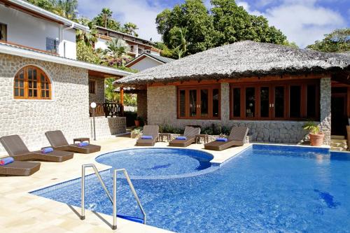 Villa con piscina y casa en Cote Jardin - Chalets Cote Mer, en Baie Sainte Anne