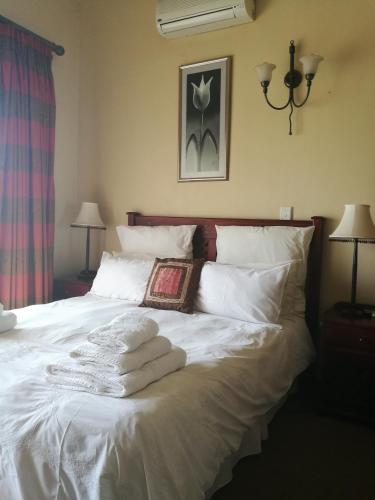 Katil atau katil-katil dalam bilik di Krige Lodge B&B