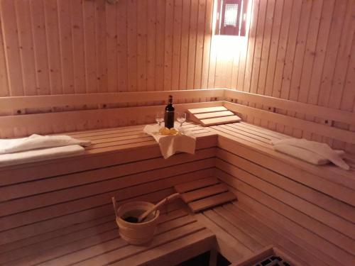 a bottle of wine sitting in a sauna at Darius HSTL in Sunny Beach