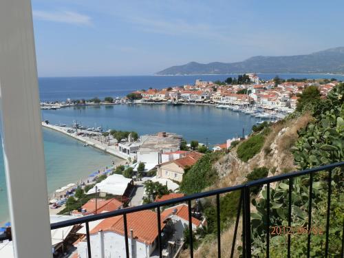 a view of a harbor from a balcony at Samos Rooms in Pythagoreio