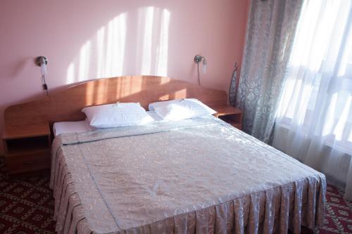 Postel nebo postele na pokoji v ubytování Atlant Hotel